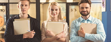 Two young men and a young woman getting ready for a job interview