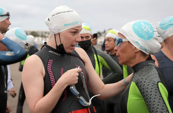 Coach speaking to a triathlete.