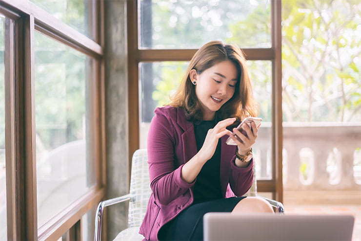 Smiling woman on cell phone