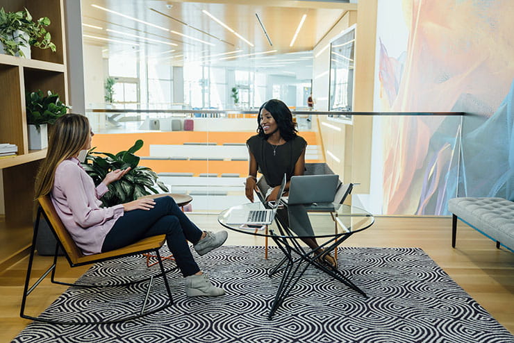 Two women on chairs