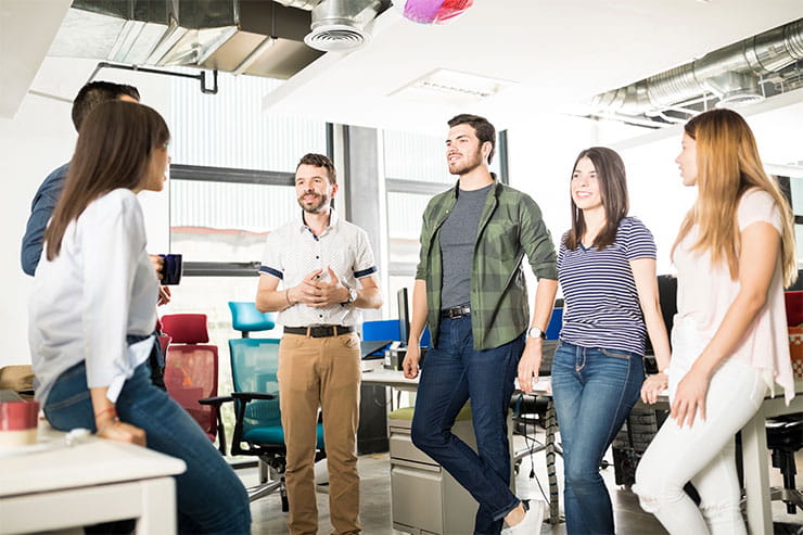 How to evaluate a job offer: business team chatting at coffee break