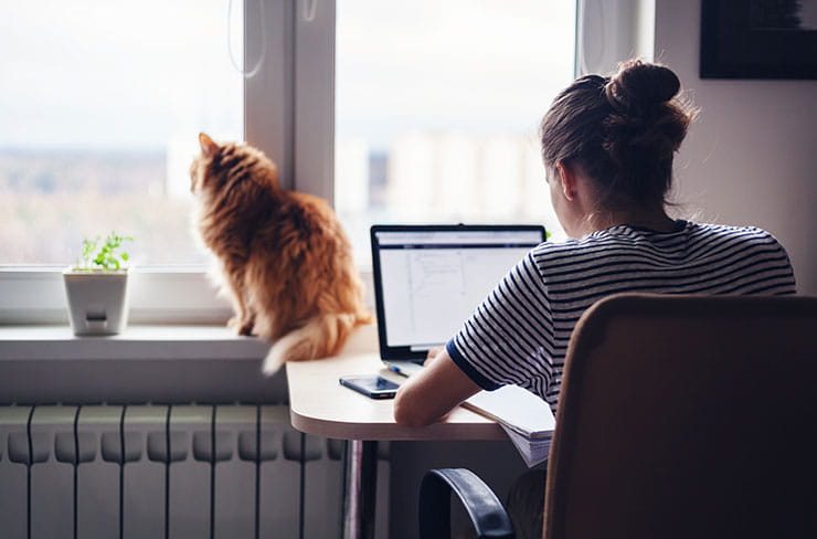 Social distancing tips: freelancer working at home.